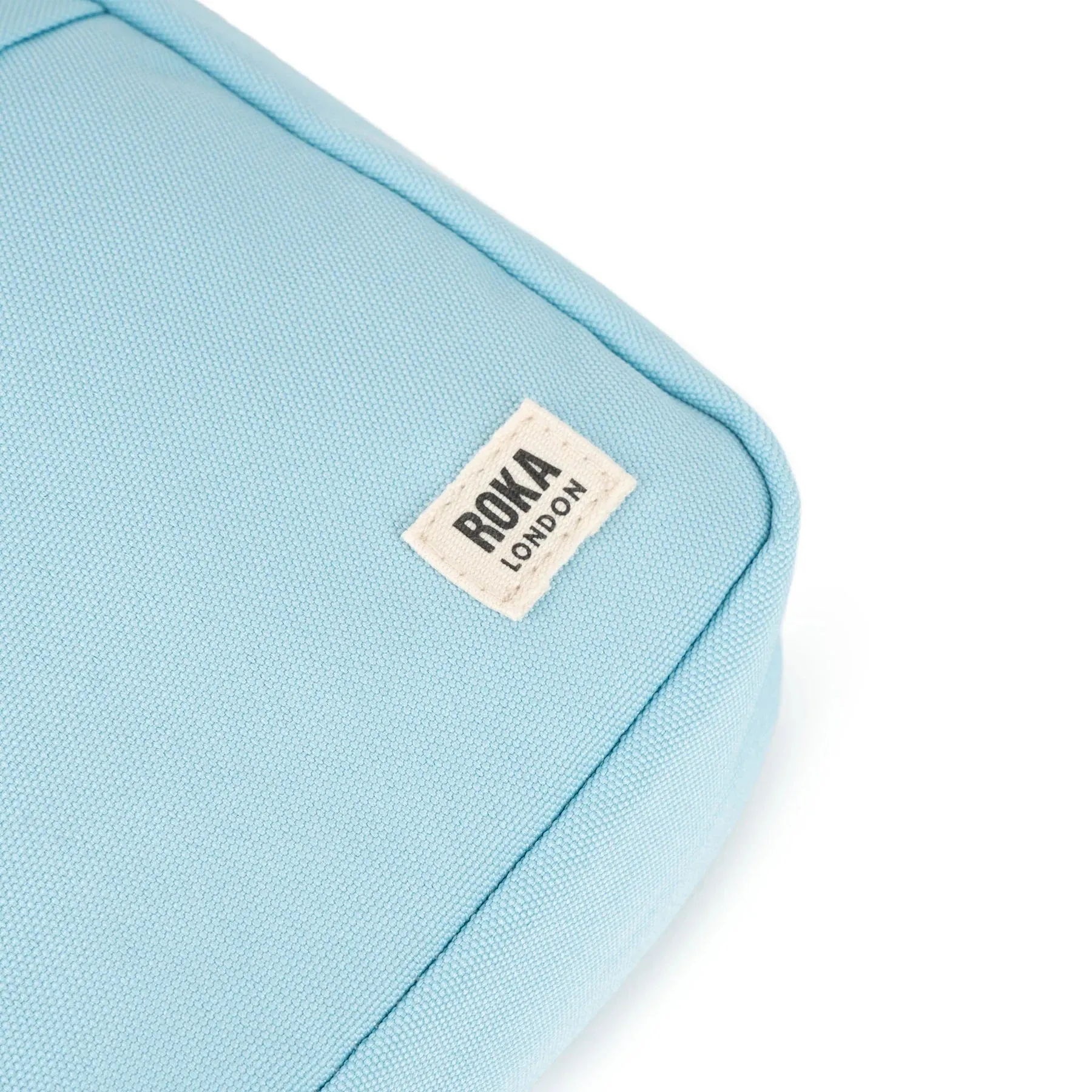 ROKA Bond Small Recycled Canvas Crossbody Pocket Bag | Ice
